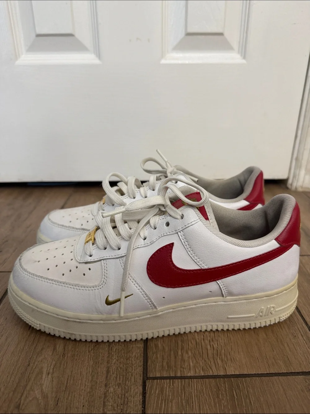 Nike Air Force 1 '07 ESS White Sneakers with Red Swoosh